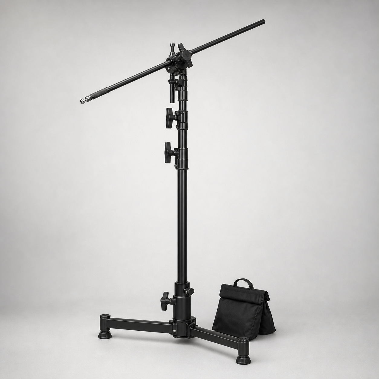 Black C-Stand creator boom kit with turtle base and sandbag
