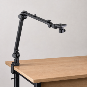 Desk overhead camera arm clamped to a creator workstation