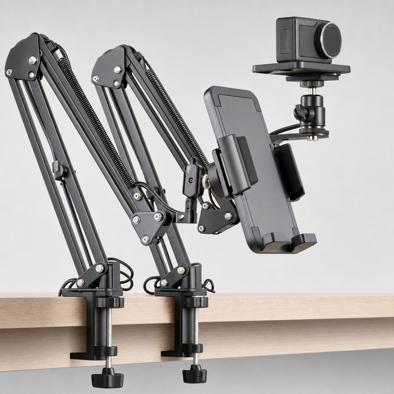 Dual overhead arm spring joint and phone holder detail